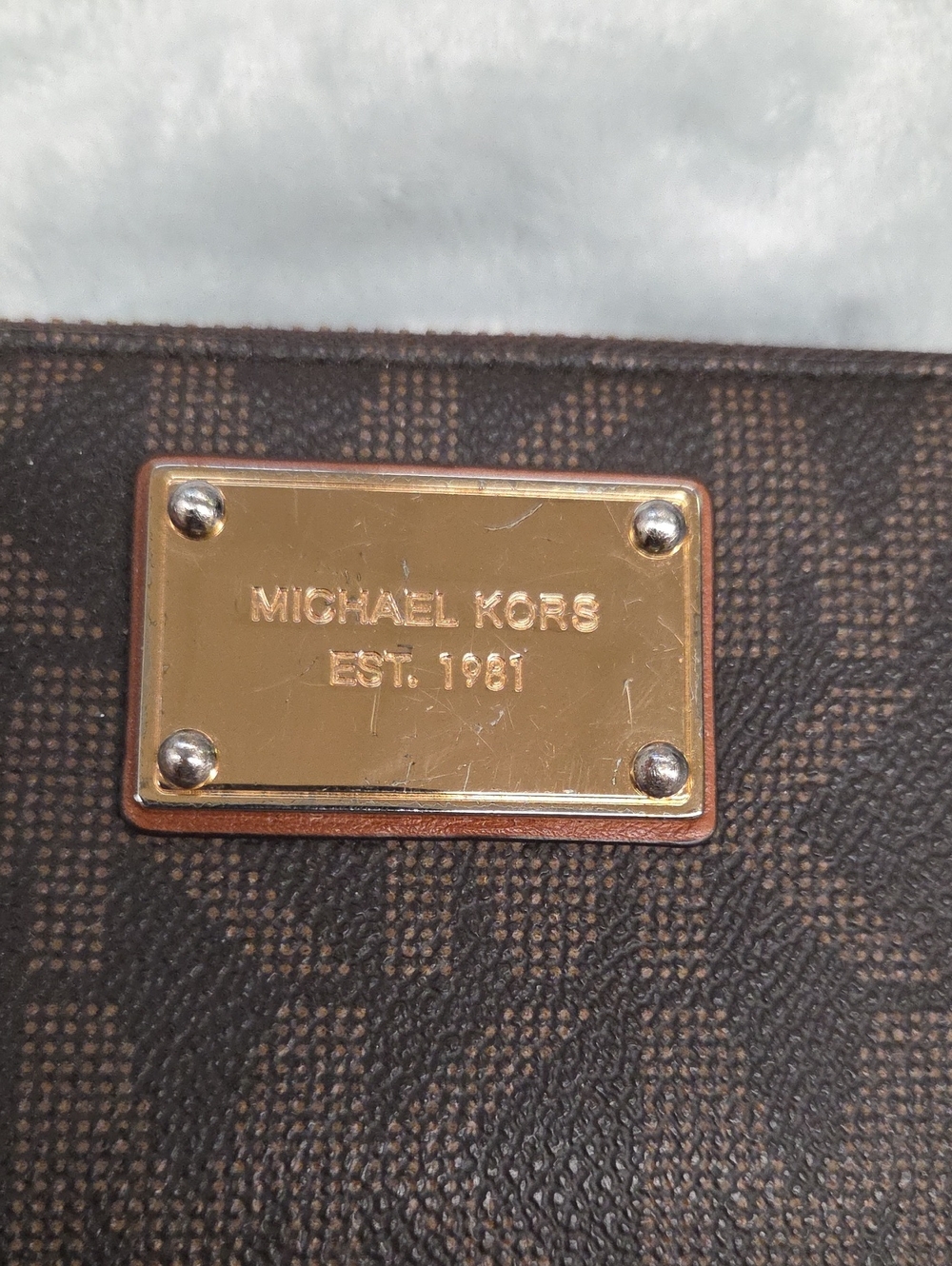 Michael Kors Brown Monogram Crossbody with Gold Plaque